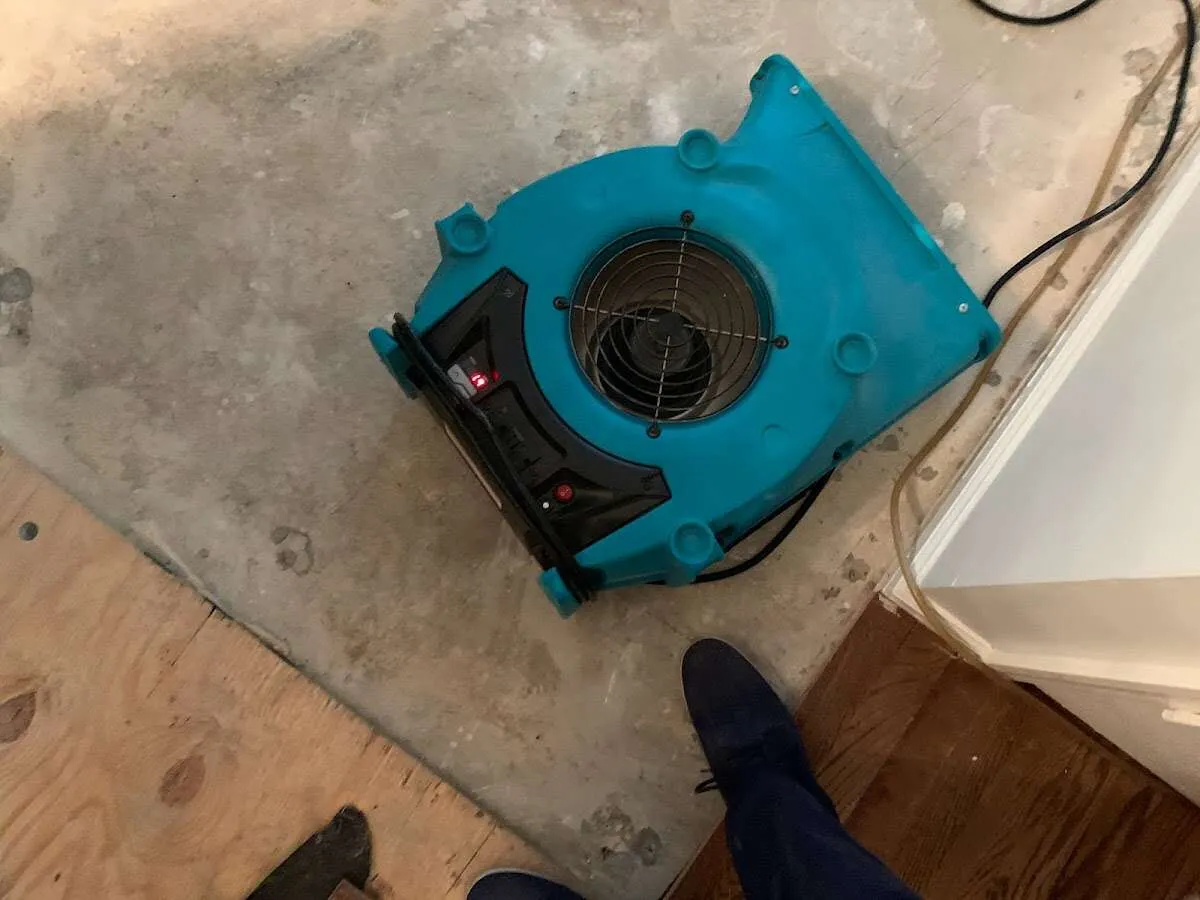 Air mover drying subfloor during Commercial Water Damage Restoration in Upper Uwchlan